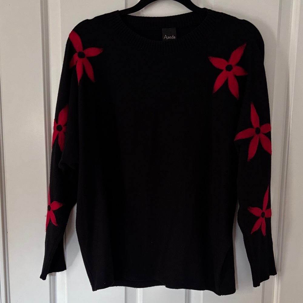 Black Sweater with Red Floral Accents